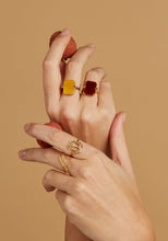 Load image into Gallery viewer, Hands wearing gold rings with precious stones, carnelian, jade

